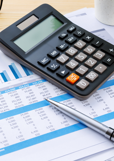 Calculator and Pen on a Document